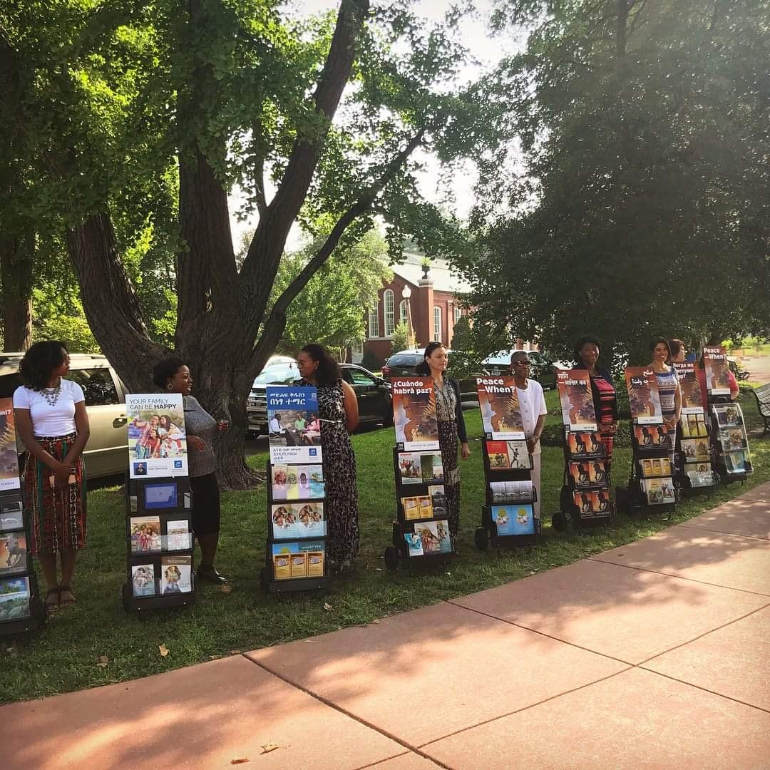 Group gathering image showing members in conversation.